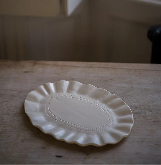 Morgan Wright The Studio Frilly Oval Platter on a beige kitchen background 