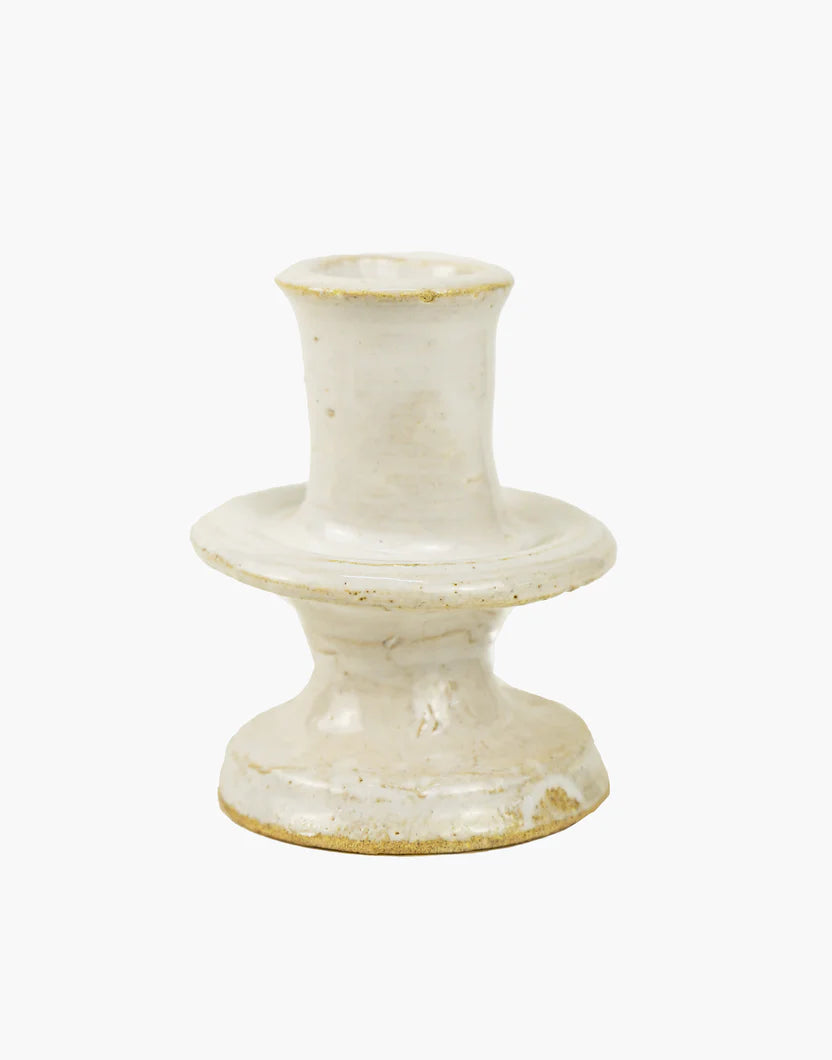 White ceramic candle holder on a white background