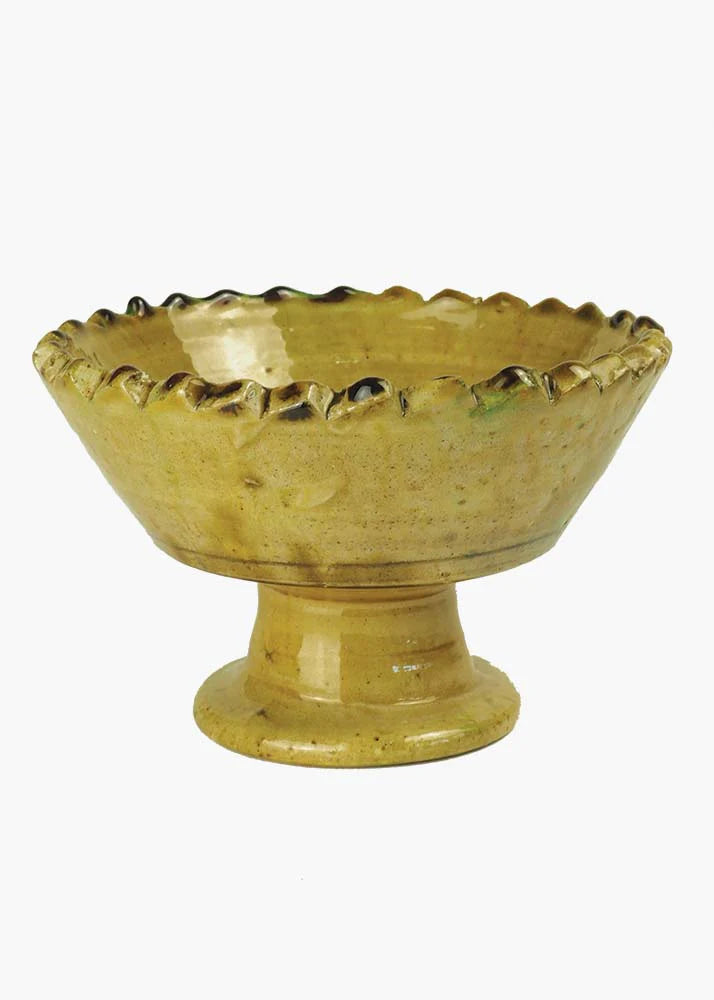 Large green handmade rustic fruit bowl on a white background 