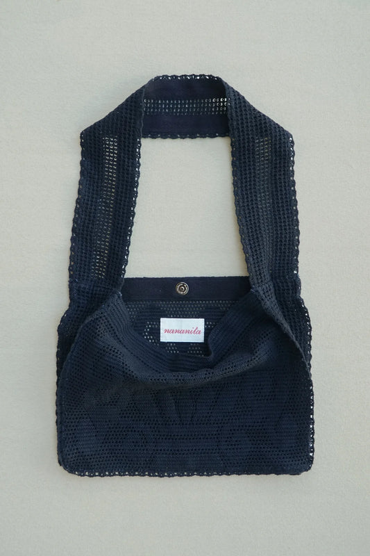 NANANITA Fountain Crochet Bag in Black colour on a beige background 