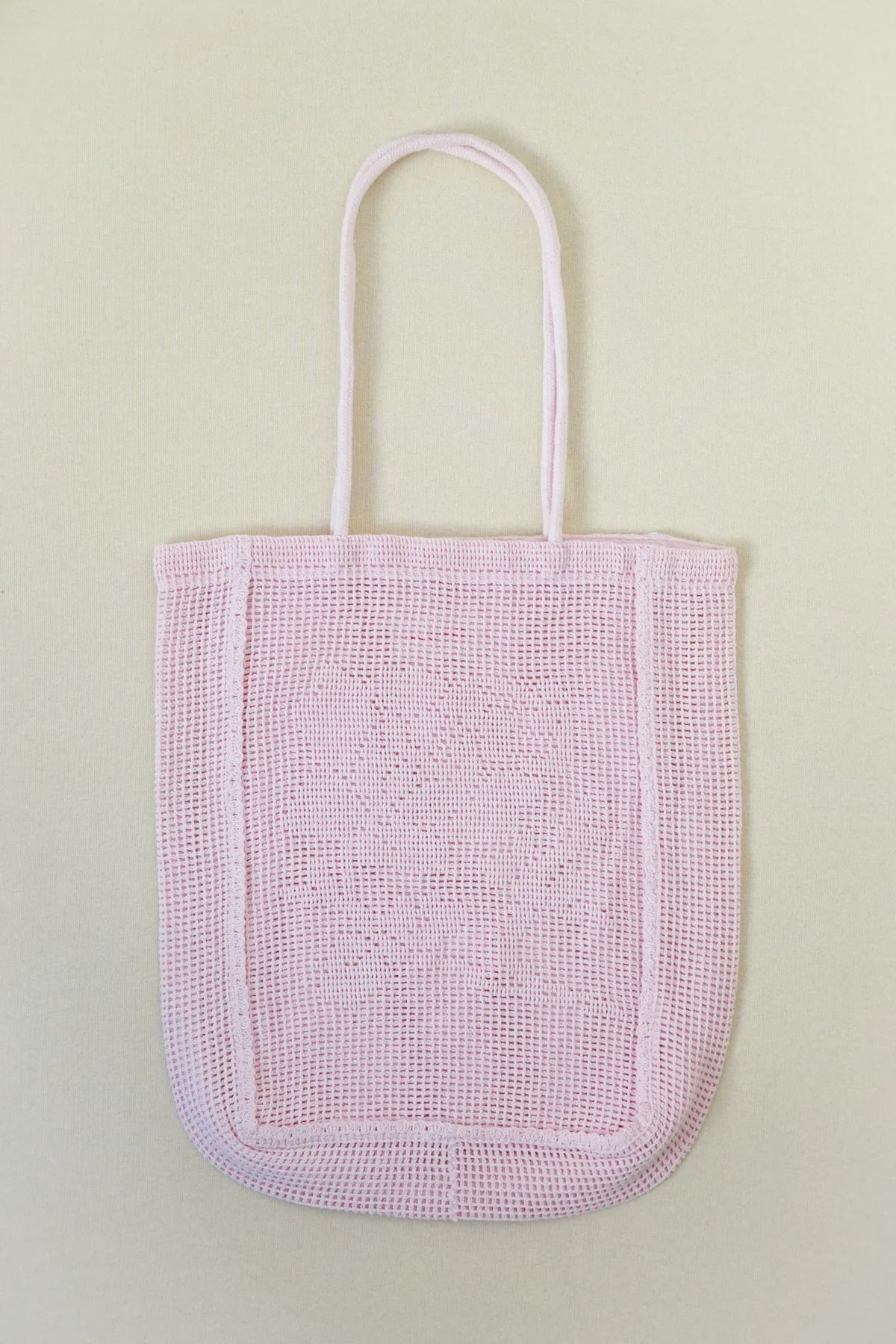 NANANITA Rose Crochet Bag in Petal pink colour on a beige background 