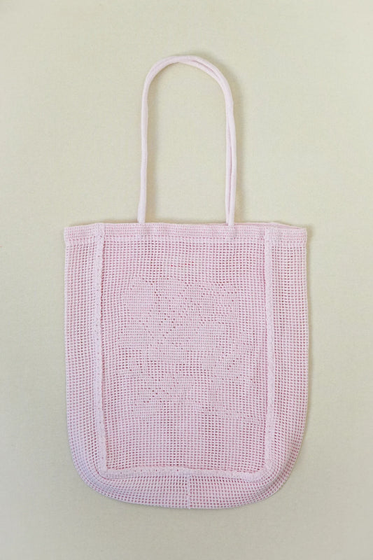 NANANITA Rose Crochet Bag in Petal pink colour on a beige background 