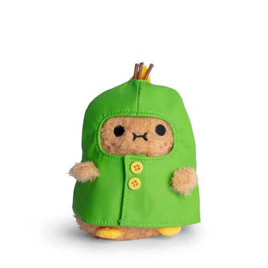 Stuffed toy with a potato soft toy in a green raincoat on a white background