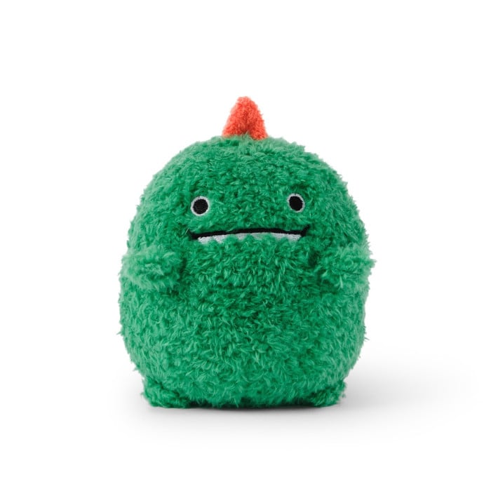 Green plush toy with a small red horn on a white background