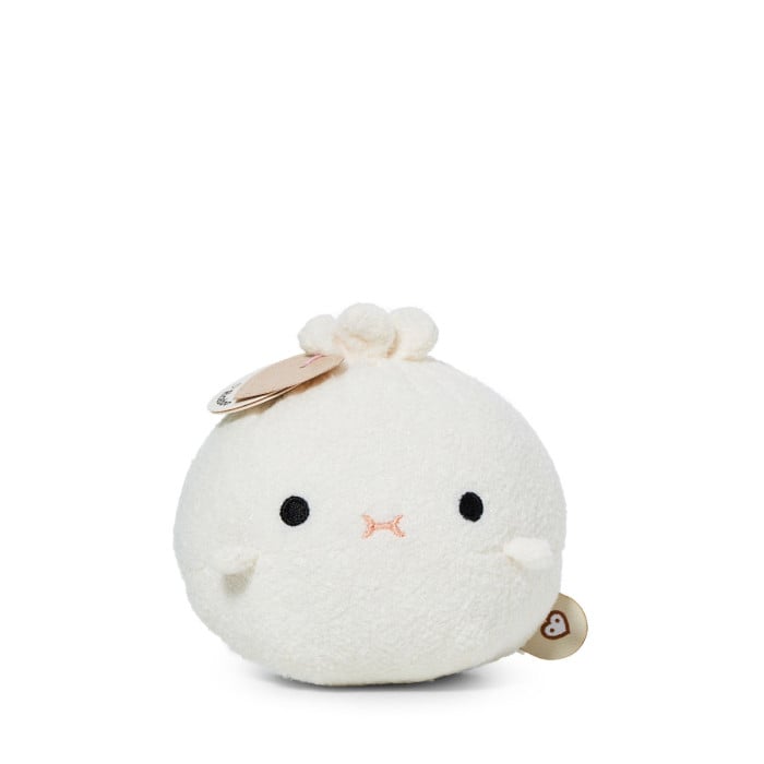 White plush toy bao ban with black eyes on a white background
