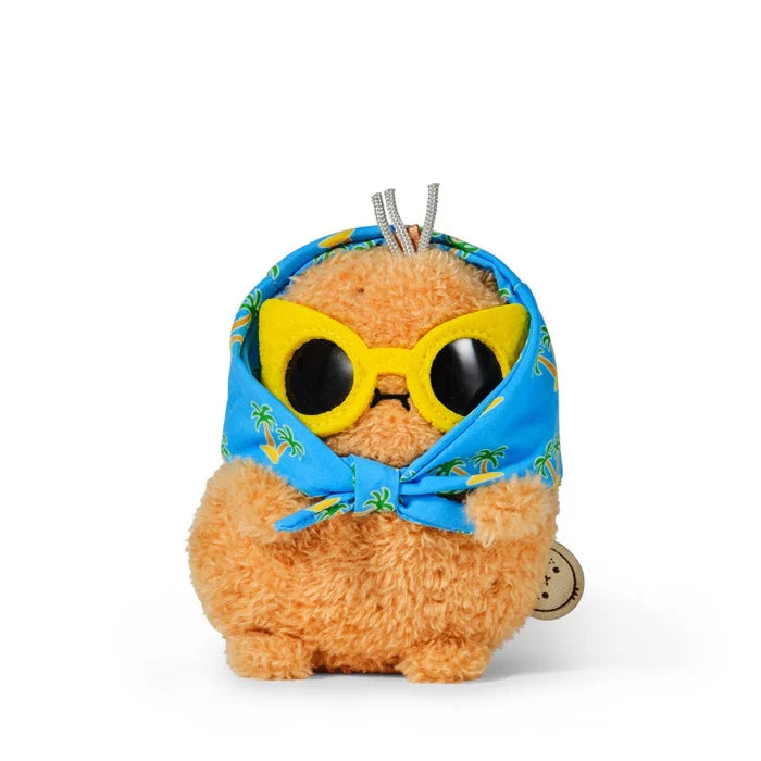 Plush toy resembling a pineapple with sunglasses and a bandana on a white background