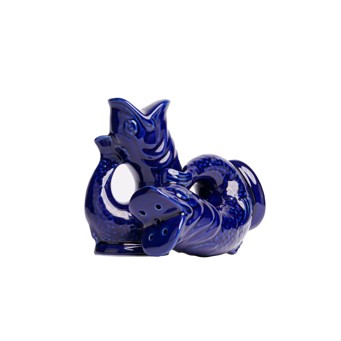 Blue ceramic cfish shaped object on a white background