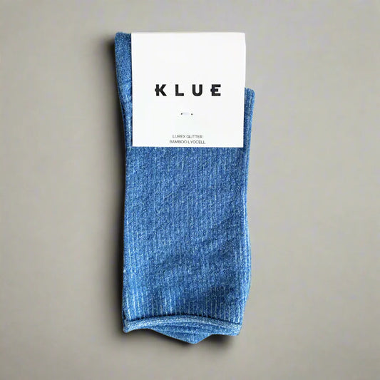 Blue sock with a KLUE label on a beige background