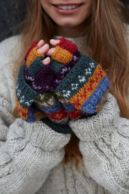 A person wearing multicolour wool fingerless Gloves