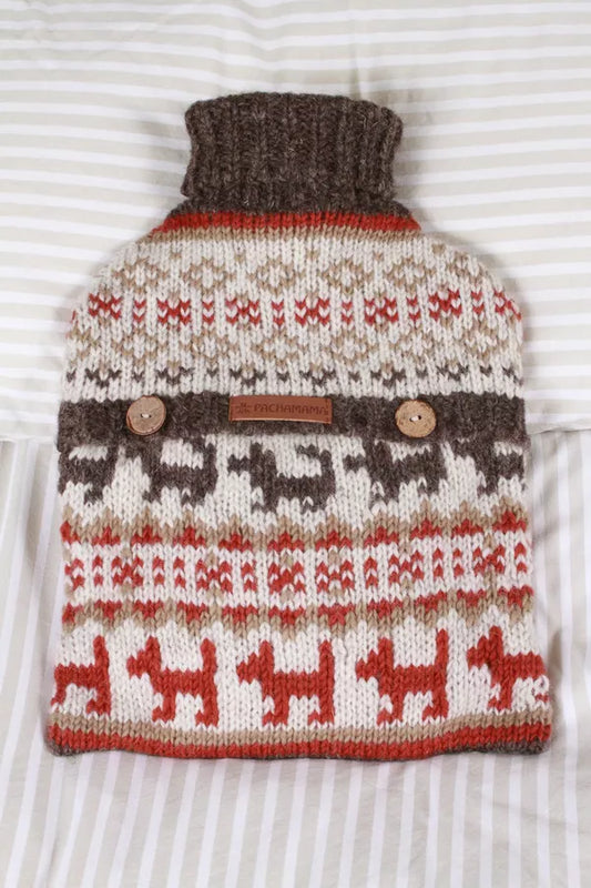 Knitted with a pattern of dogs on a white background hot water bottle 