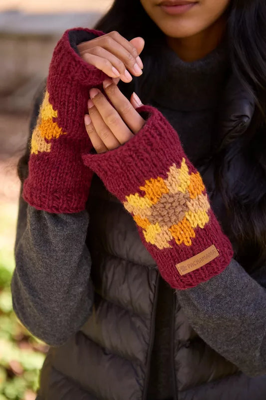 a model wearing Pachamama Sunflower Burgundy Handwarmer