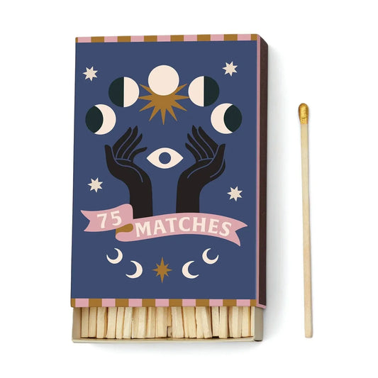 Matchbox with celestial design and '75 Matches' text on a white background