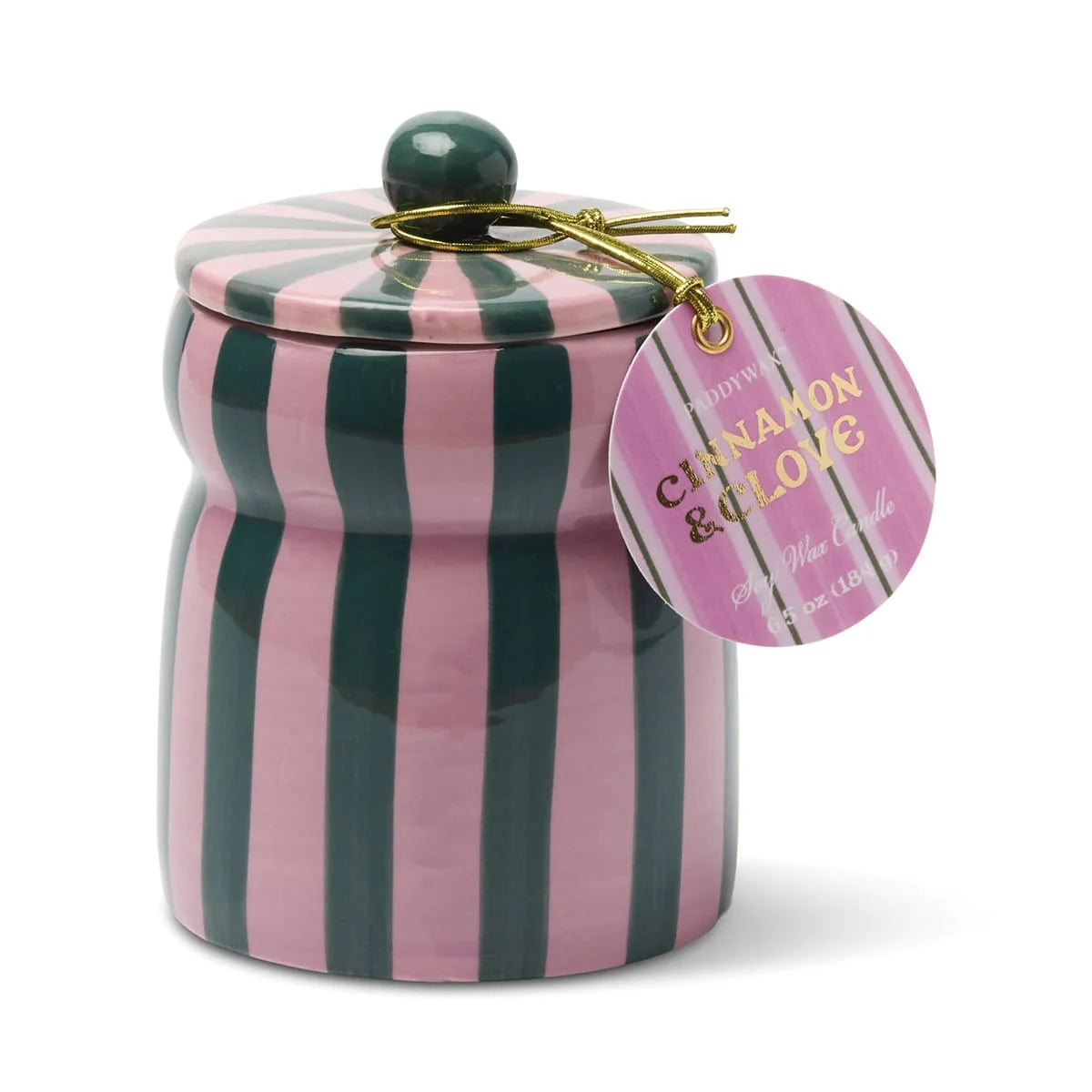 A pink and dark green vertically striped ceramic jar candle with a matching lid and a round hanging tag that reads 'Cinnamon & Clove' by the brand Hot Toys.