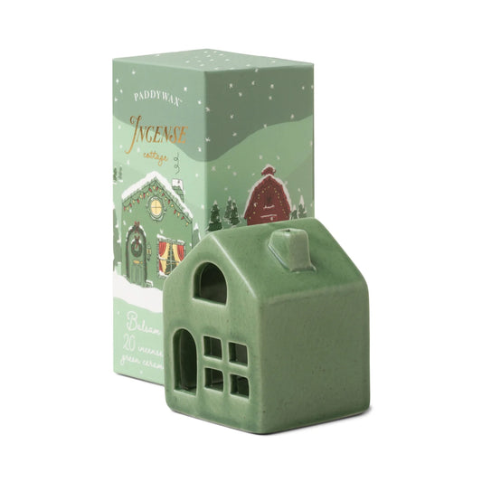 Green house-shaped incense burner with matching box on a white background