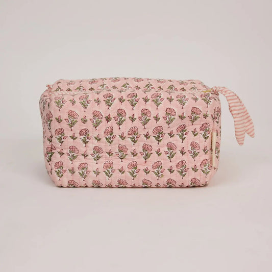Floral-patterned pouch on a light gray background