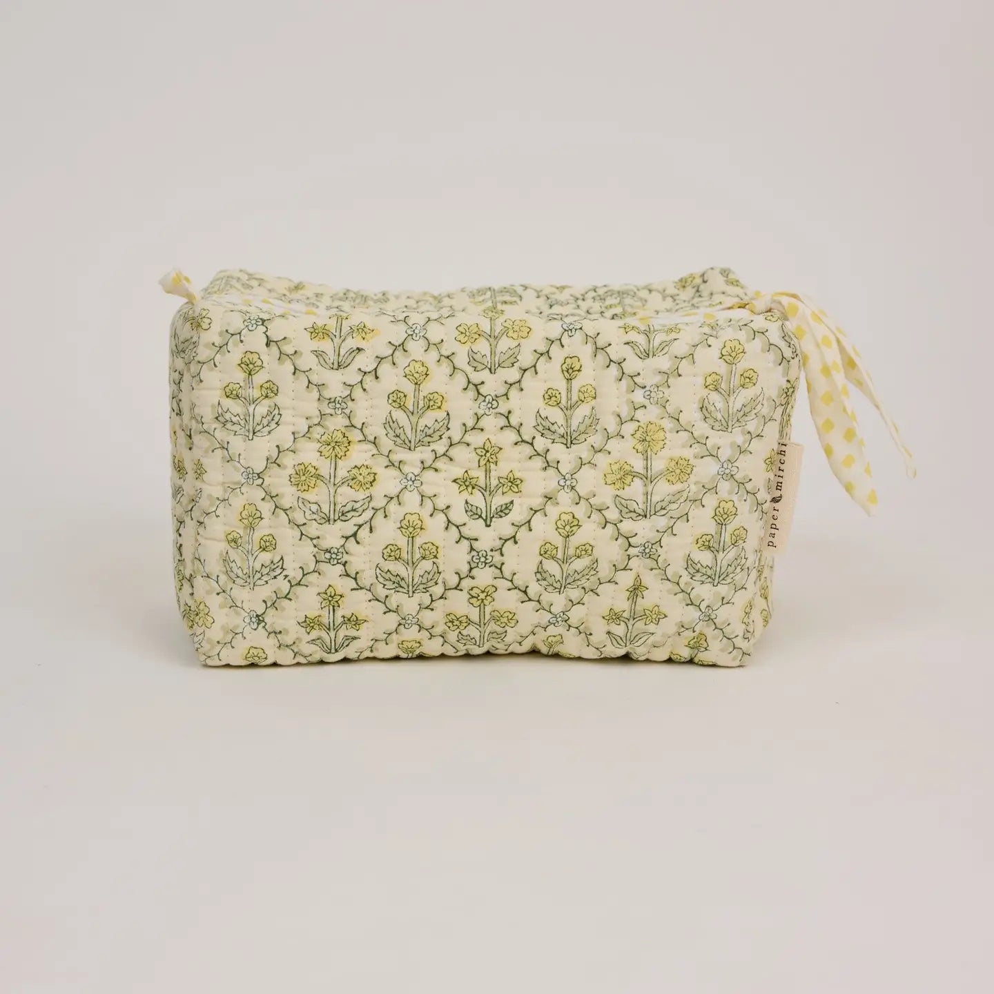Fabric pouch with floral pattern on a white background