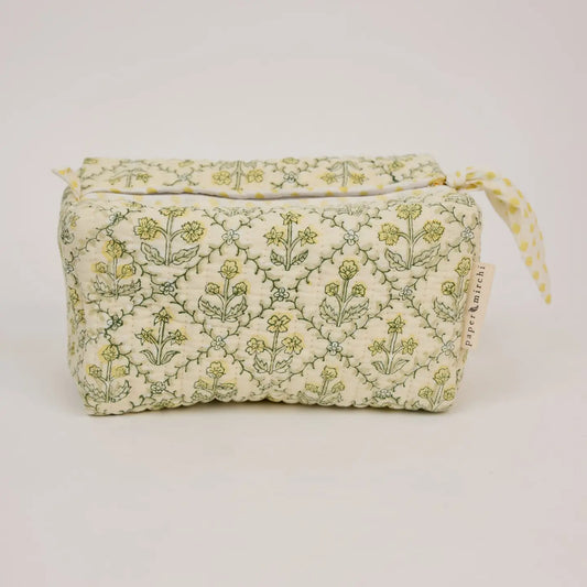 Floral-patterned fabric bag on a light gray background