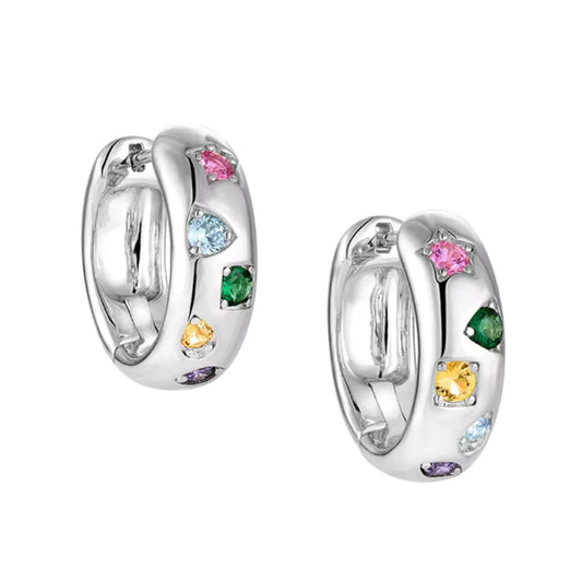 A pair of silver huggie hoop earrings decorated with small, colorful gemstones in pink, light blue, green, yellow, and purple, set against a plain white background.