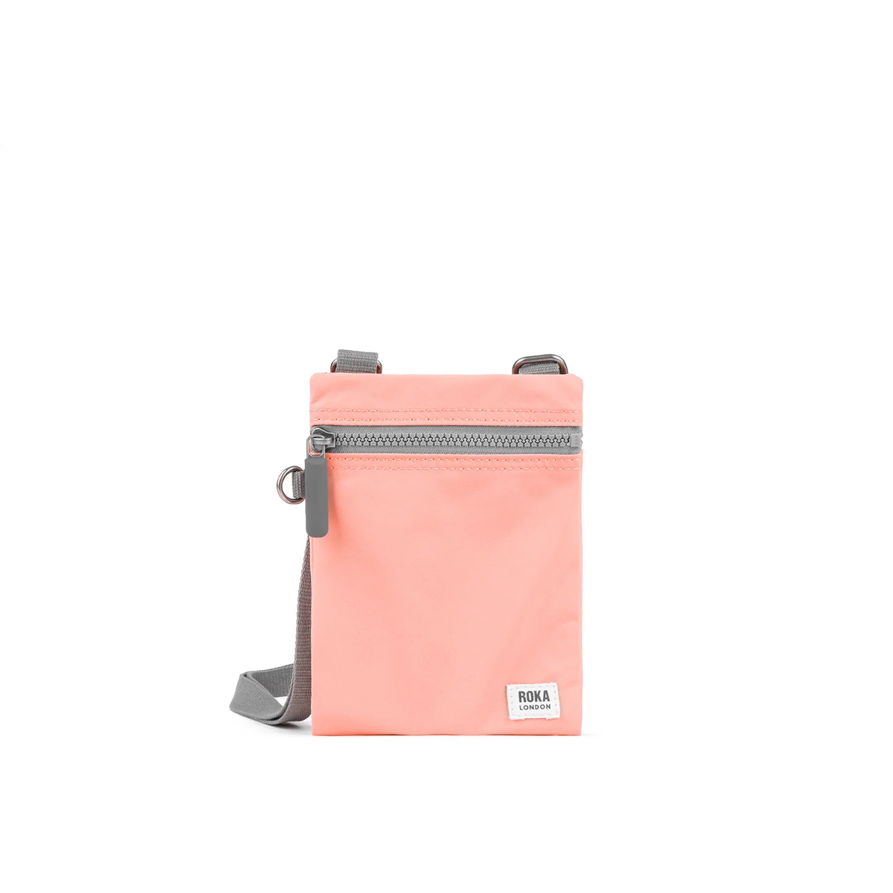 Roka Chelsea Recycled Nylon Bag in 'Punch' colour a peachy pastel pink