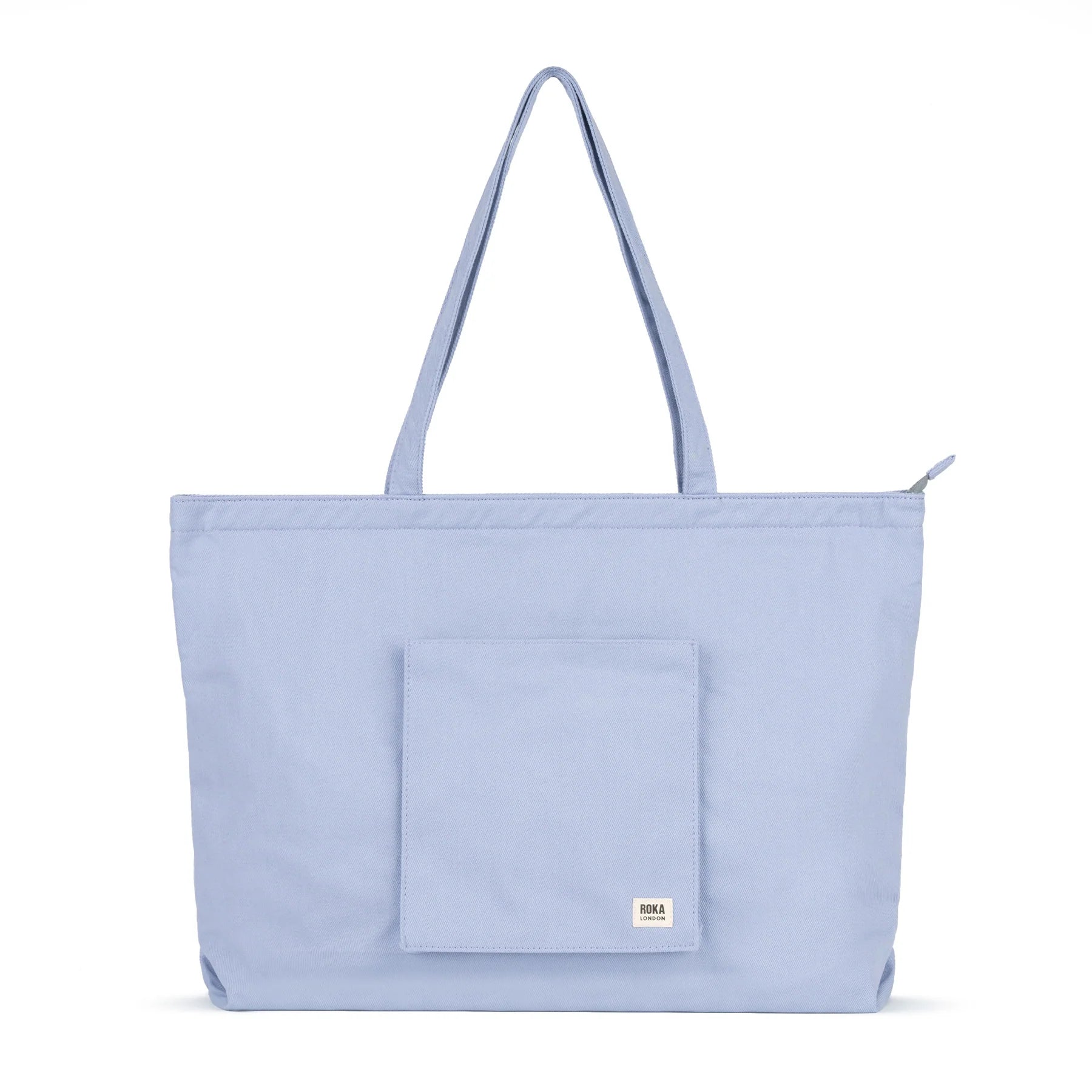 Light blue tote bag with a pocket on a white background