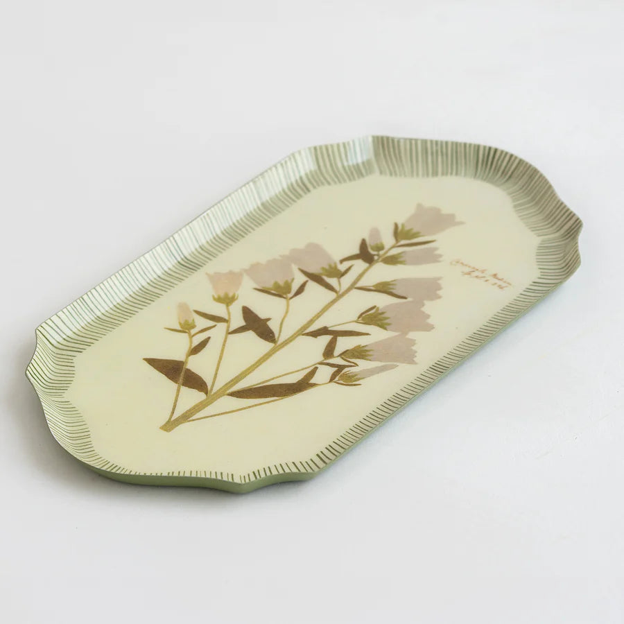 Decorative tray with floral design on a light background