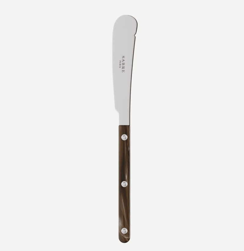 A single SABRE Paris butter knife with a silver stainless steel blade and a dark brown marbled handle, shown vertically against a light gray background.