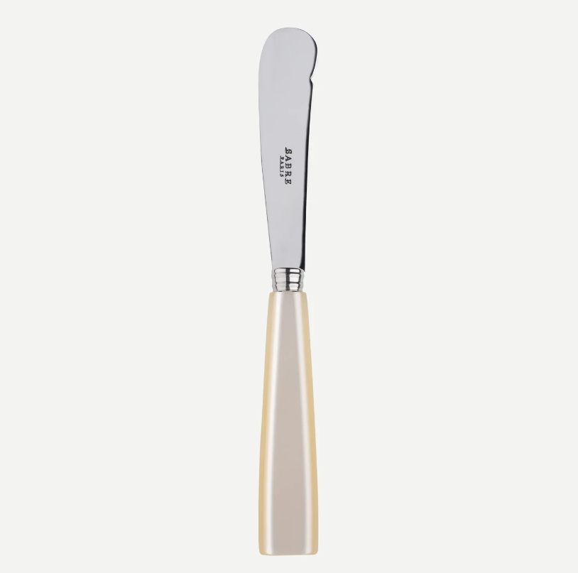 Sabre Paris butter knife with pearl-like coloured handle on a white background 