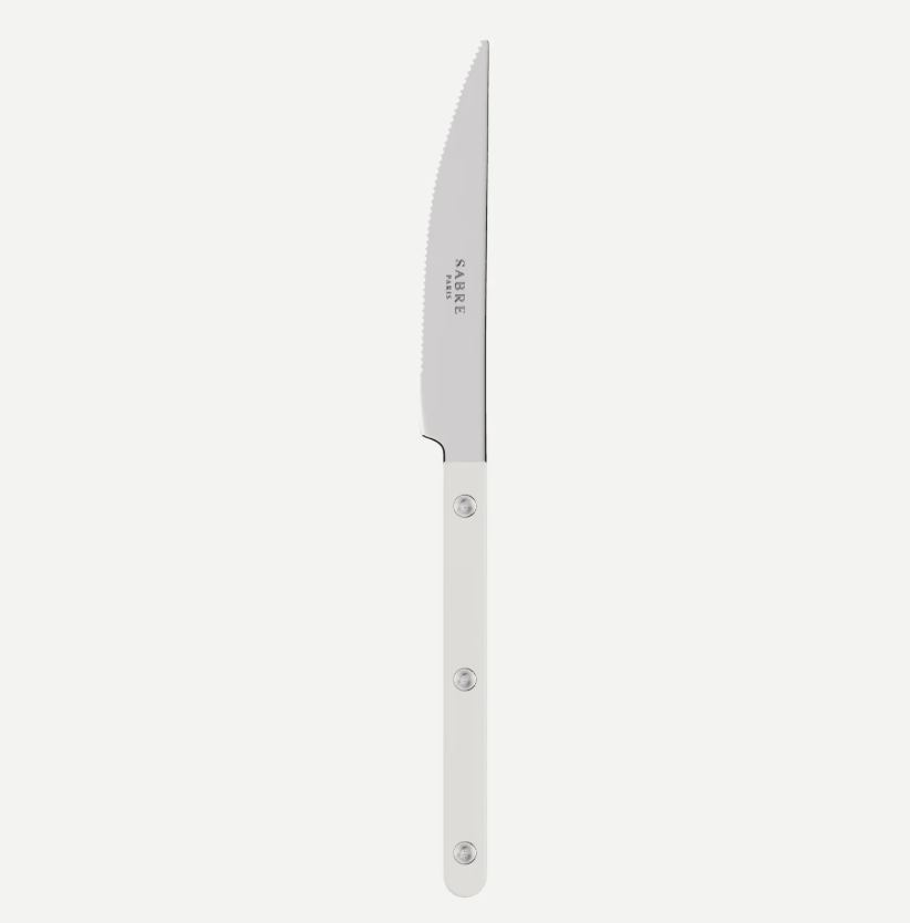 A single kitchen knife with a silver serrated blade and a white handle, shown vertically against a light gray background. The brand name 'SABRE' is printed on the blade.