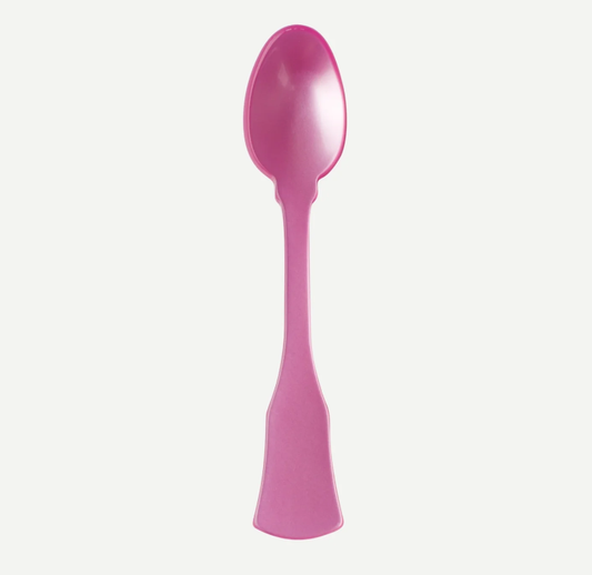 A single pink plastic spoon with a decorative handle, shown vertically against a plain light gray background.