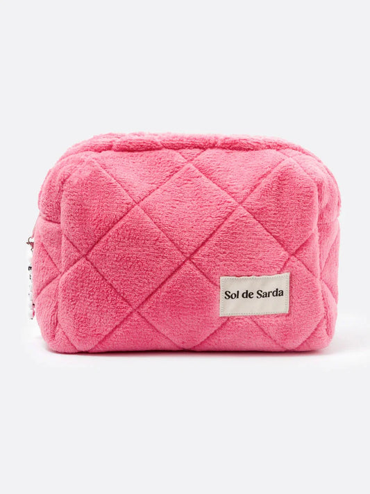 PINK TERRY MAKEUP POUCH ON A WHITE BACKGROUND 