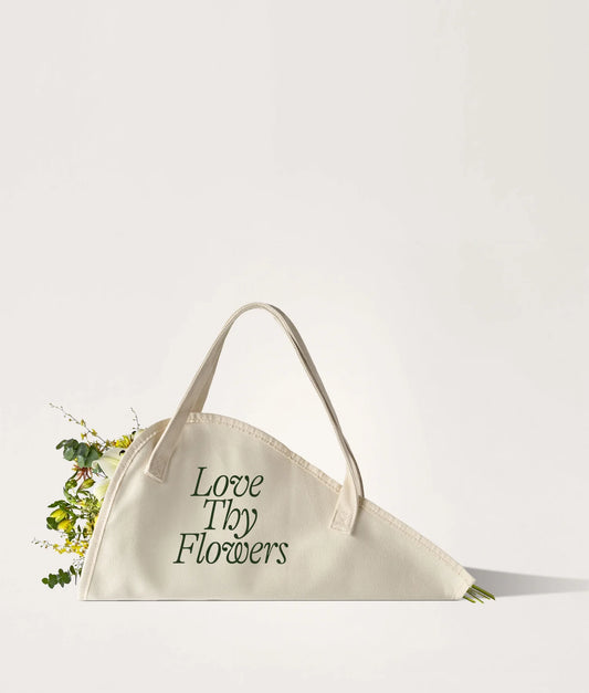 Beige flower tote bag with 'Love Thy Flowers' text on a white background