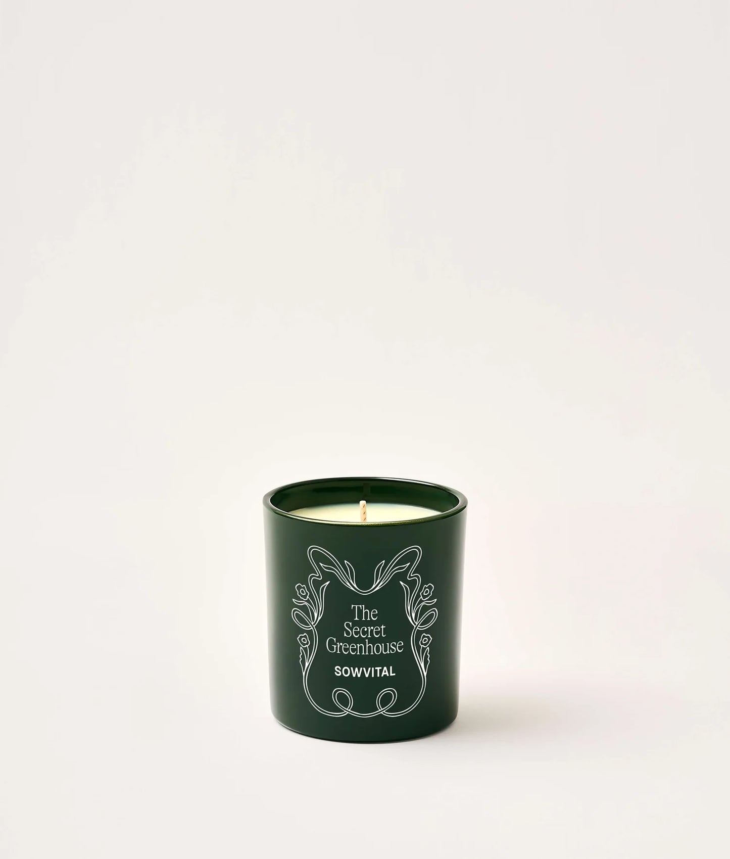 SOWVITAL Scented Candle in deep green glass jar on a white background