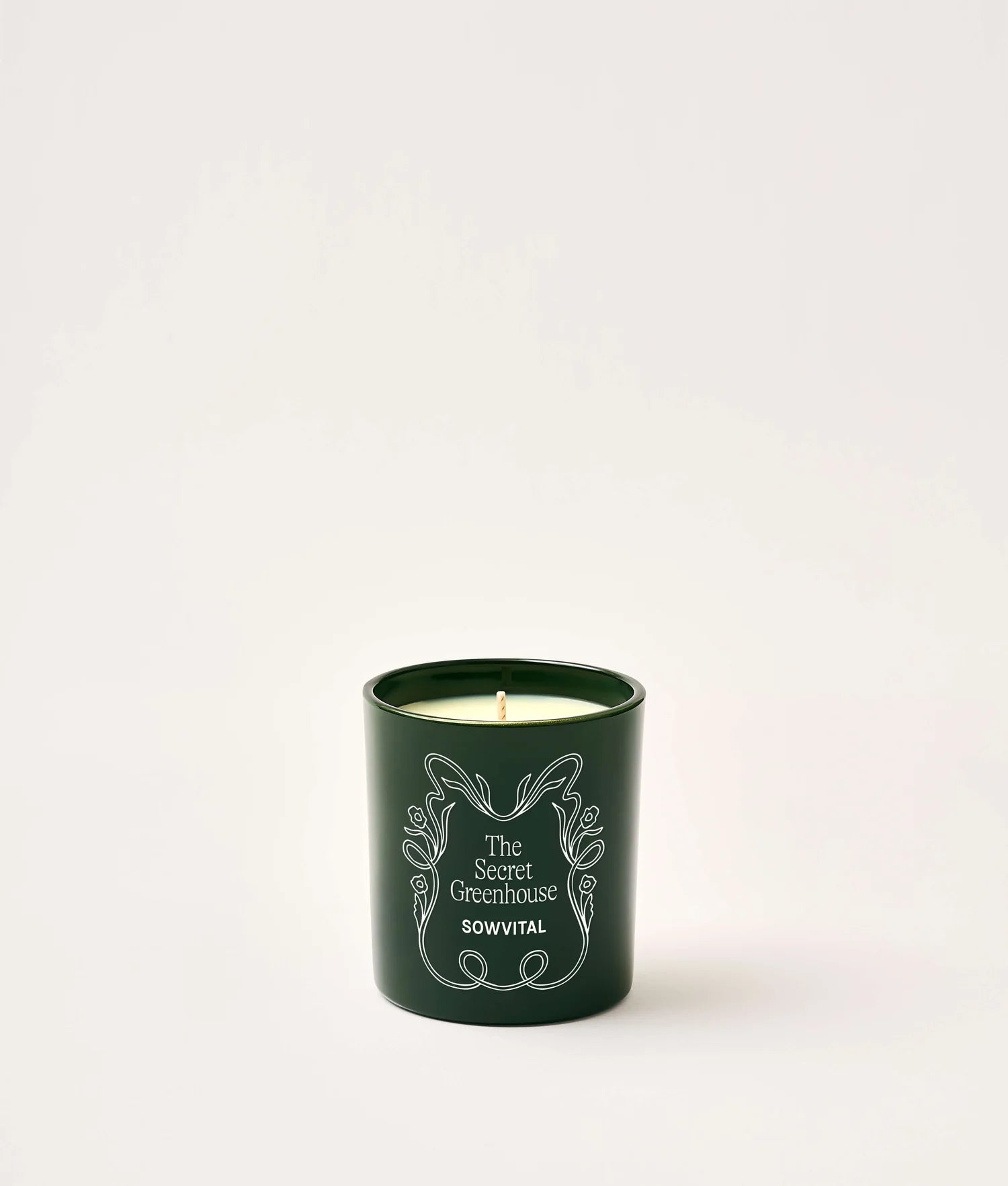 SOWVITAL Scented Candle in deep green glass jar on a white background