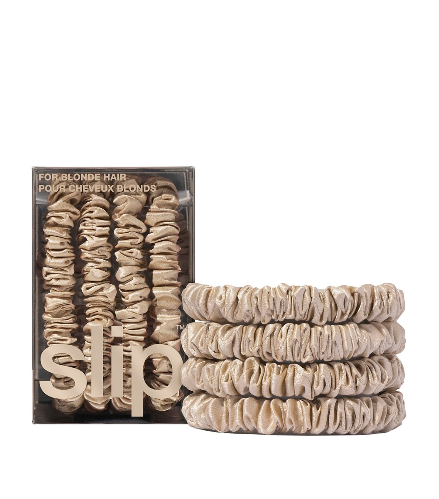 Set of beige hair scrunchies with packaging labeled 'SLIP' on a white background