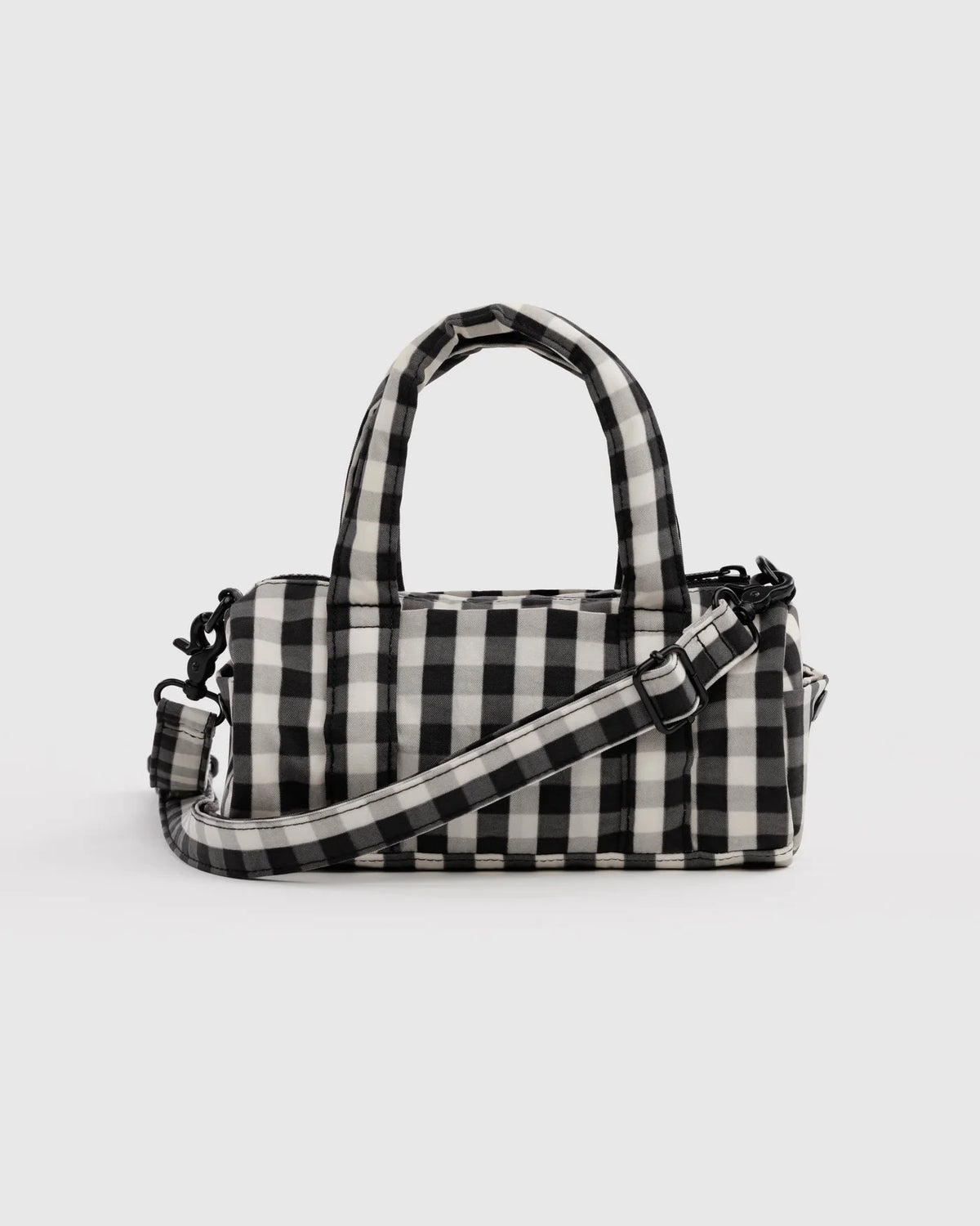 black and white ginghsm duffle bag on a white background 