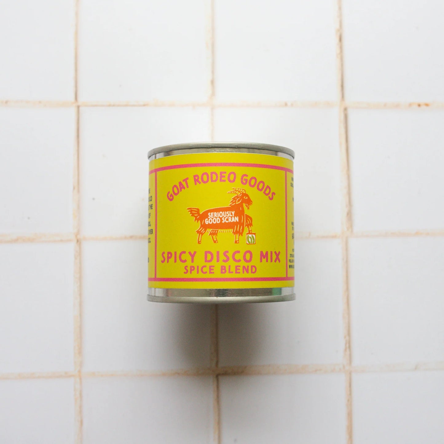 Can of Goat Rodeo Goods Spicy Disco Mix on a tiled wall