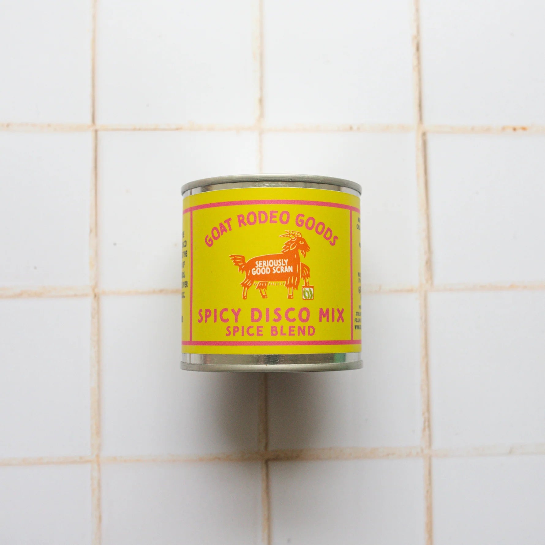 Can of Goat Rodeo Goods Spicy Disco Mix on a tiled wall