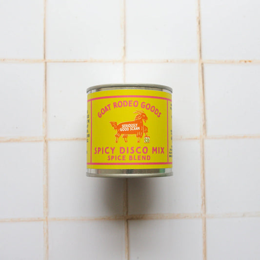 Can of Goat Rodeo Goods Spicy Disco Mix on a tiled wall