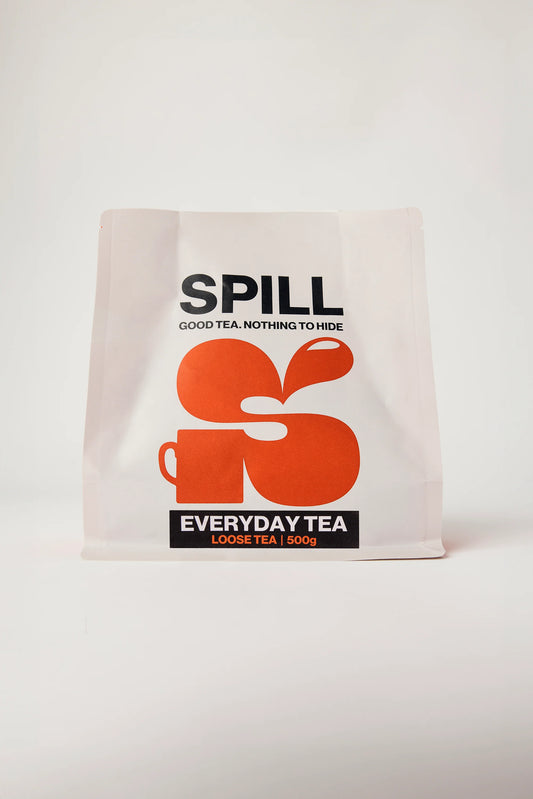 Tea bag packaging with 'SPILL' branding on a white background