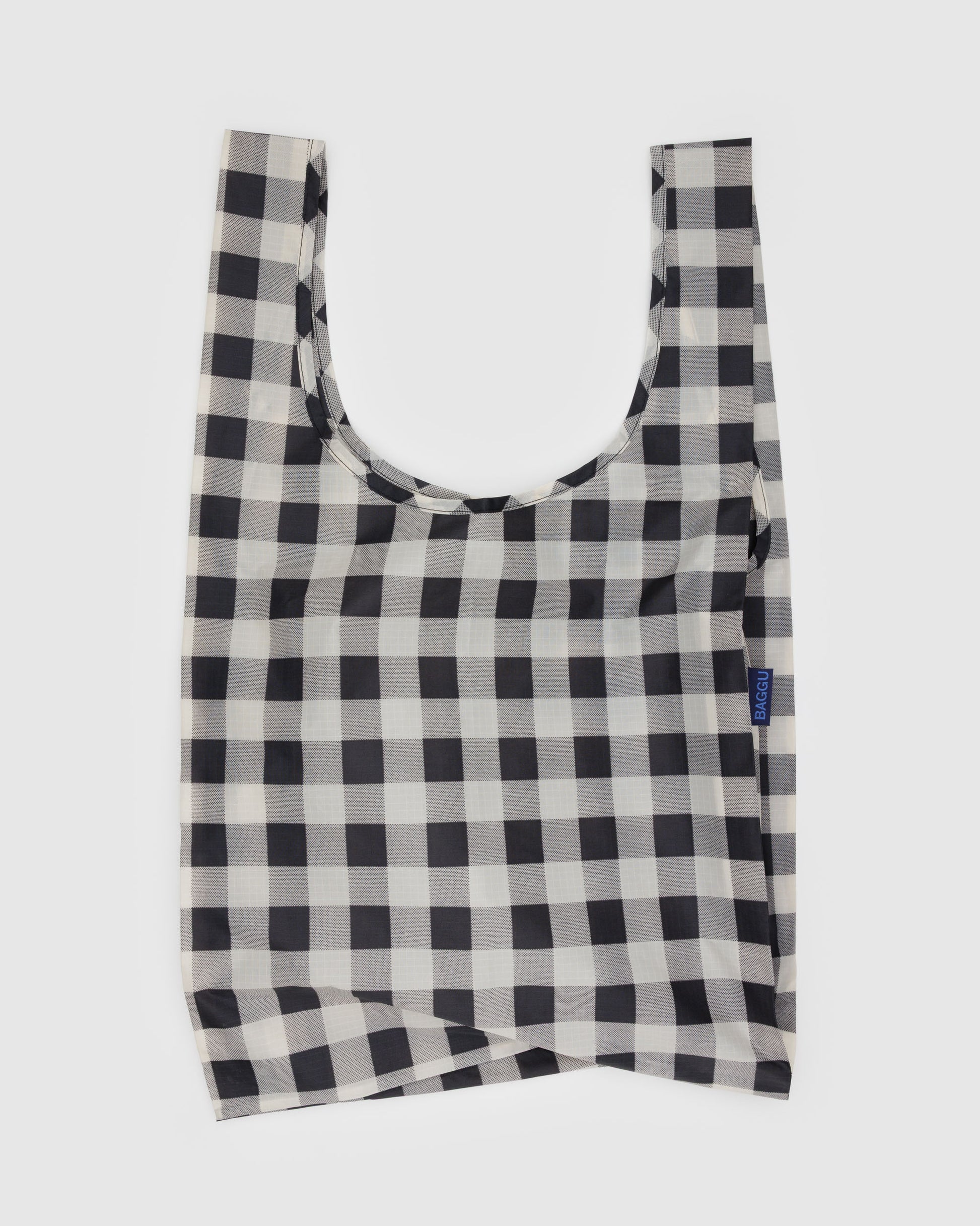Black and white checkered reusable bag on a light gray background