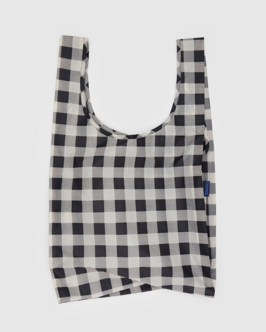 Black and white checkered reusable bag on a light gray background