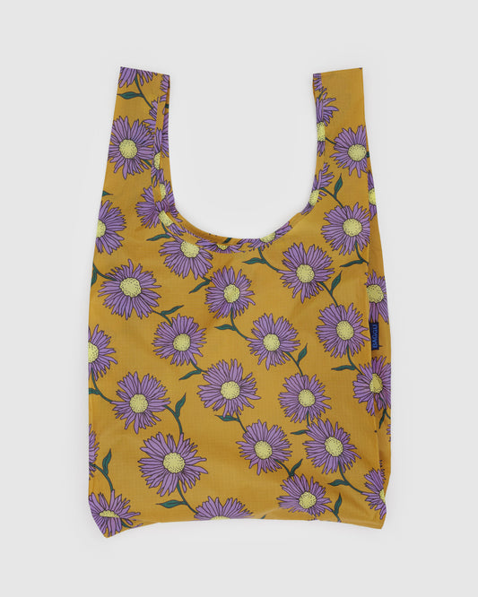 Reusable bag with purple floral pattern on a mustard yellow background