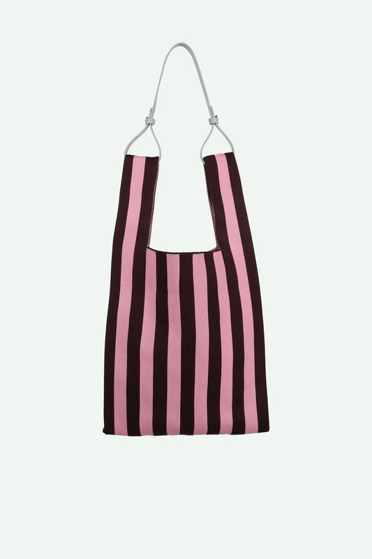 Striped bag with pink and black vertical stripes on a white background
