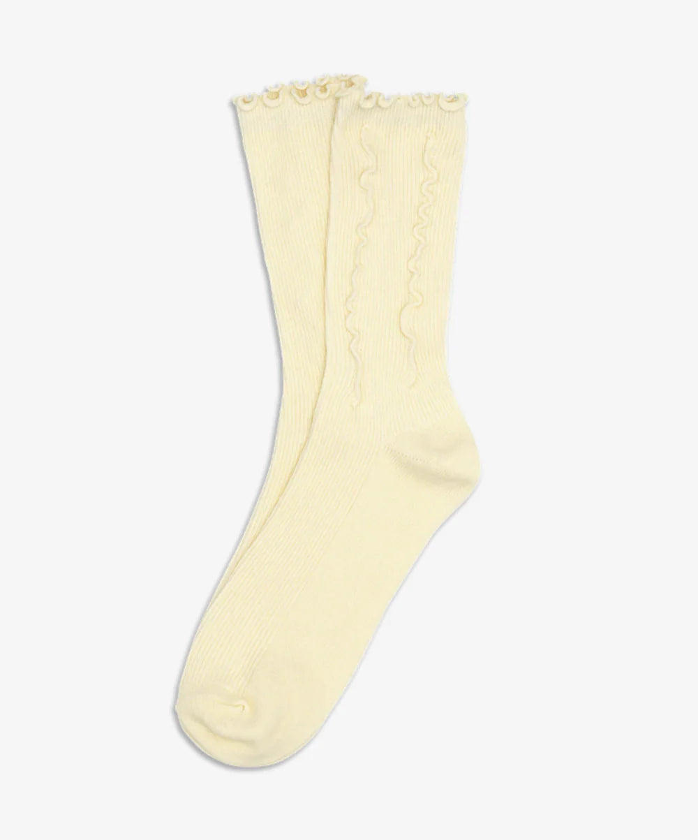 Pair of light yellow socks on a white background