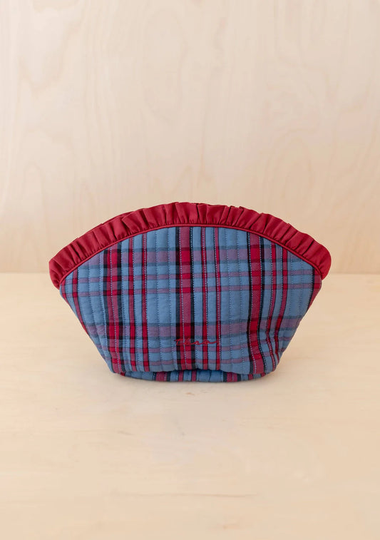 Plaid patterned product on a beige background