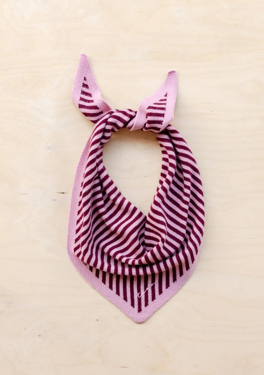 Pink and red striped bandana on a beige background