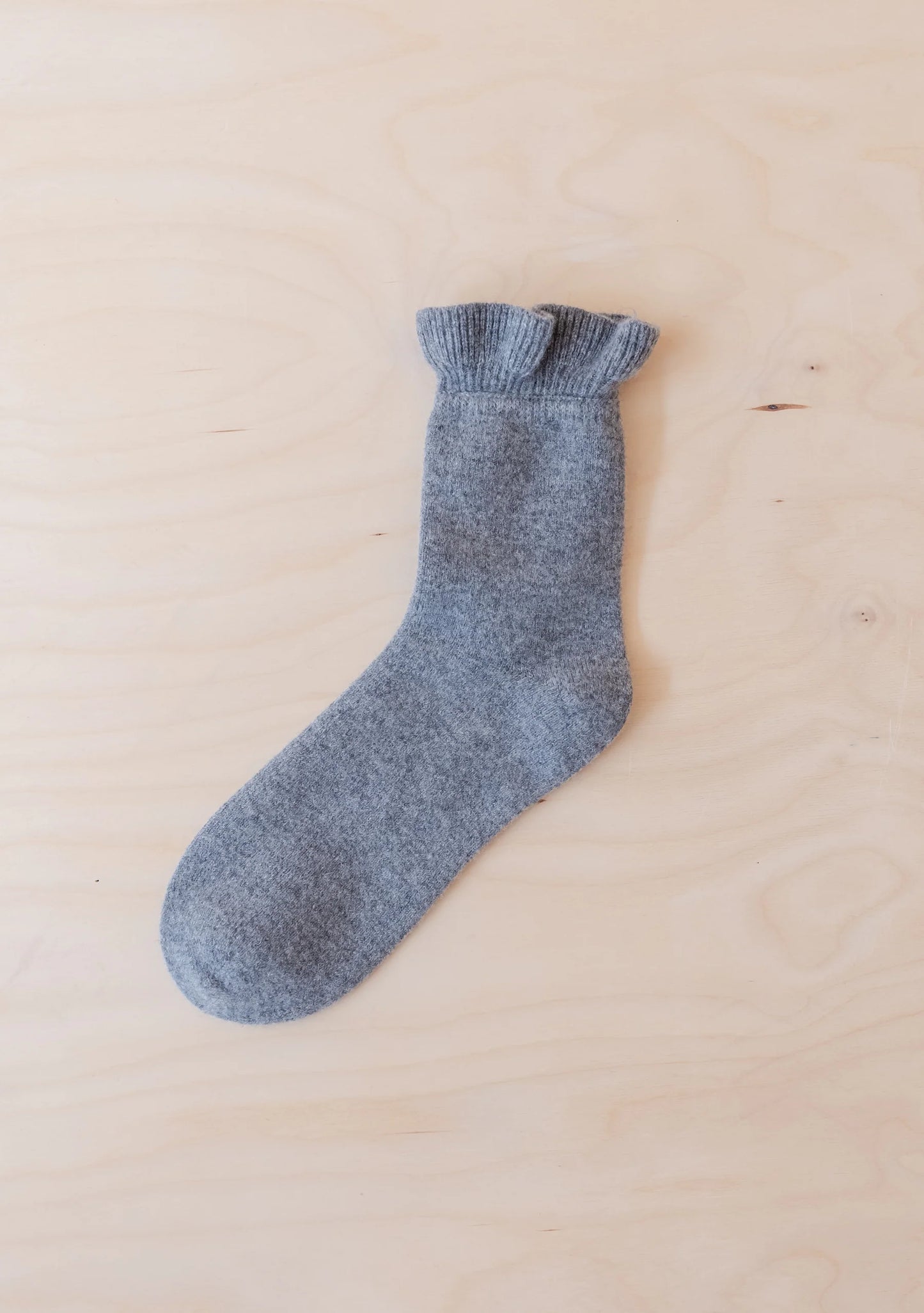 Gray sock on a beige background