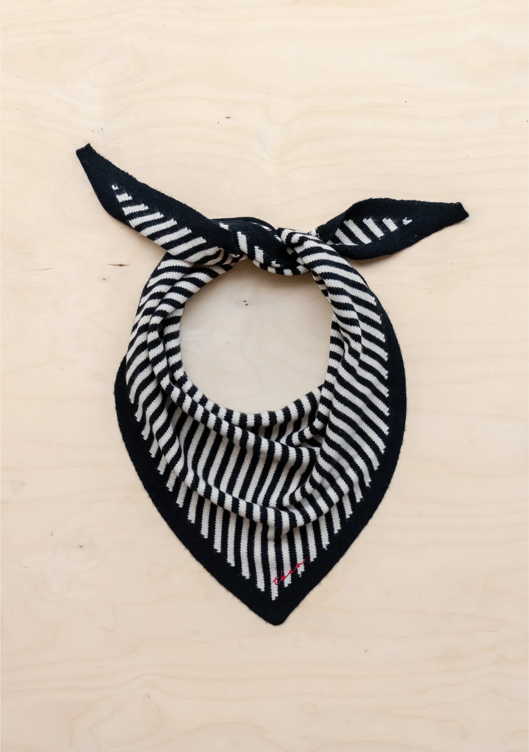 Black and white striped bandana on a beige background