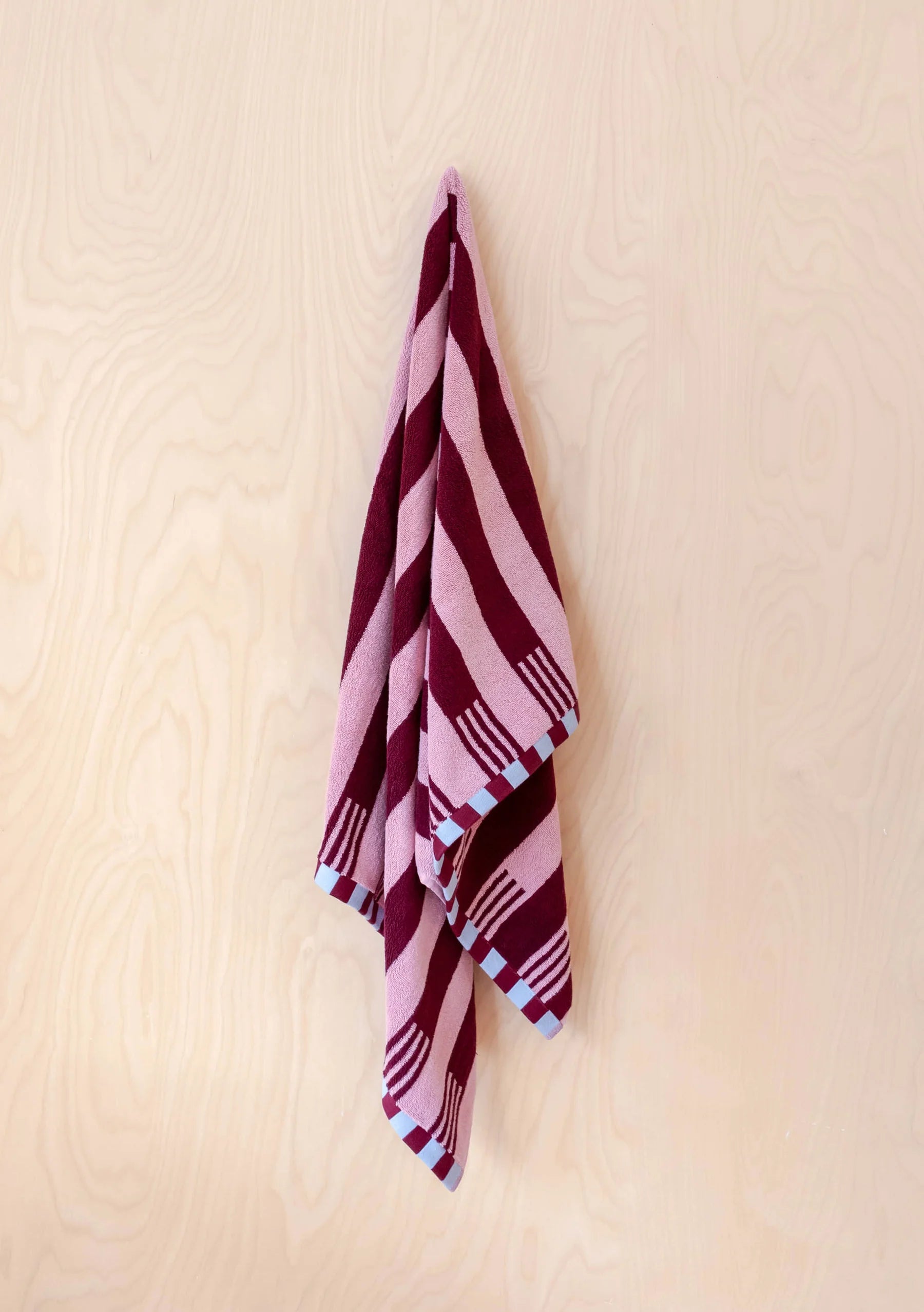 TBCo Terry Cotton Towel in Burgundy Stripe Bath Sheet on a beige background 