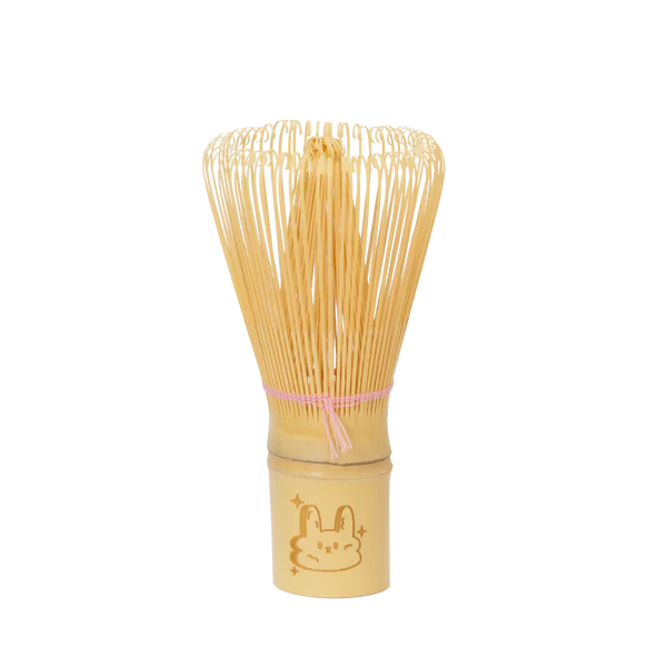 Bamboo whisk with a cute animal design on a white background